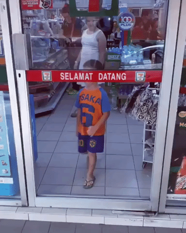 Boy Falling Through Convenience Store Door